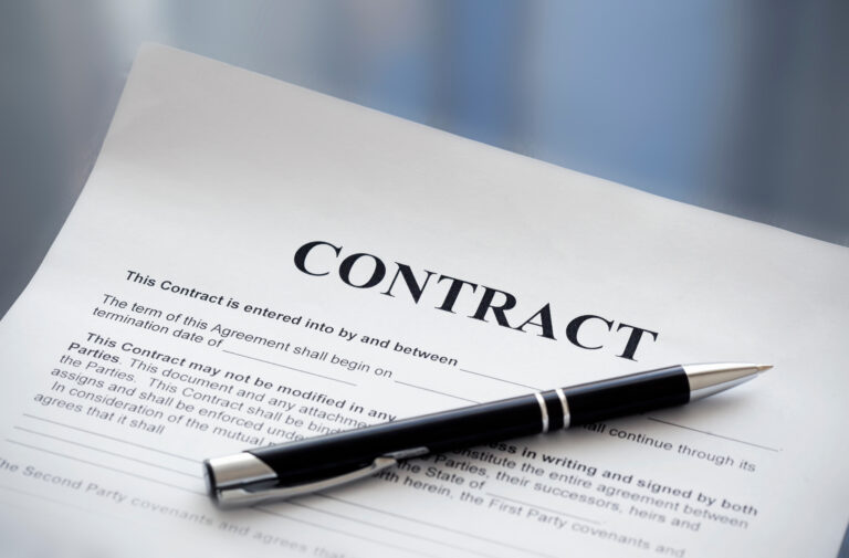 job contract waiting to be signed by someone who should take a contract job